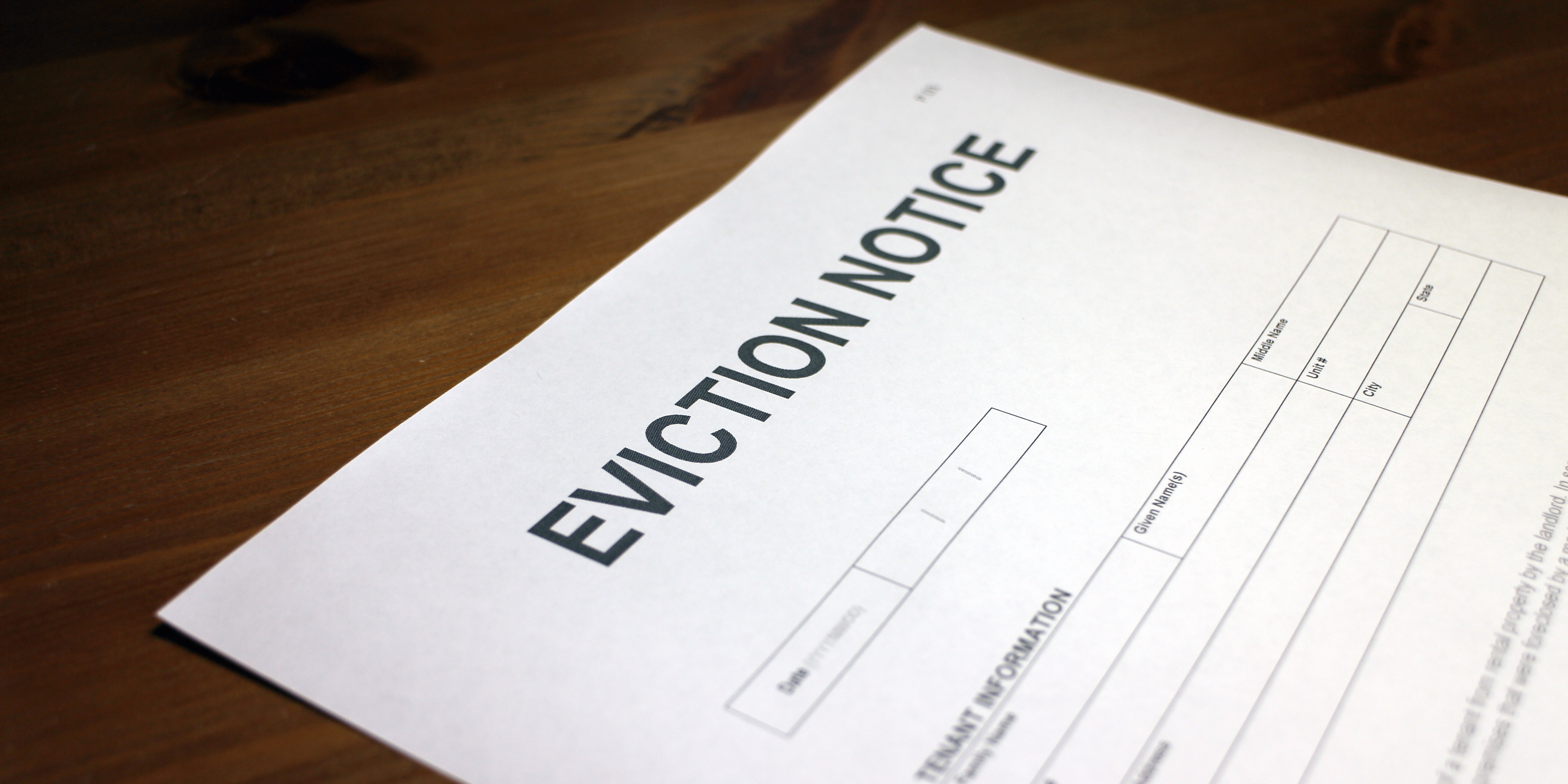Eviction notice letter on table.