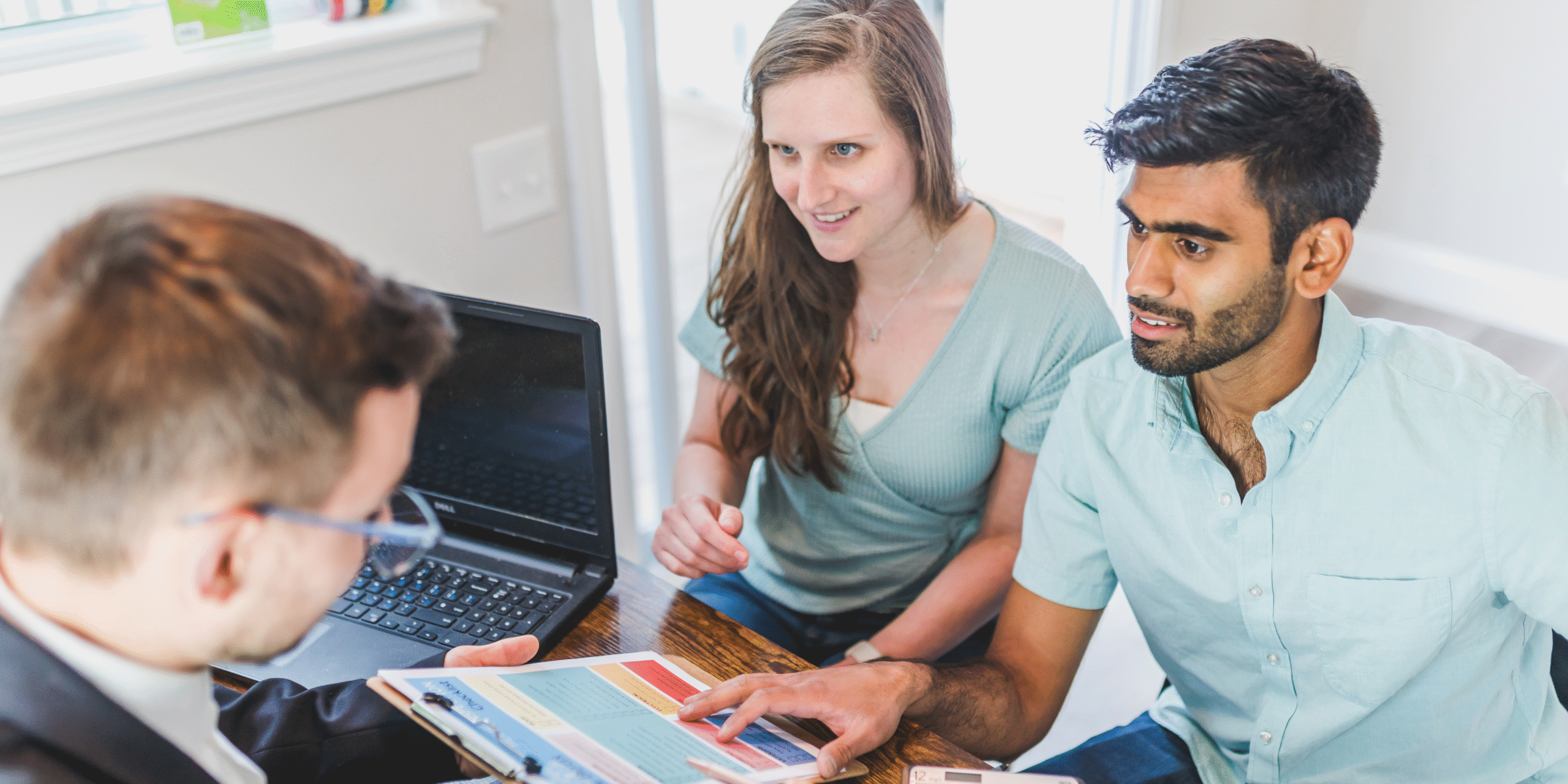 couple having meeting with estate agent. 